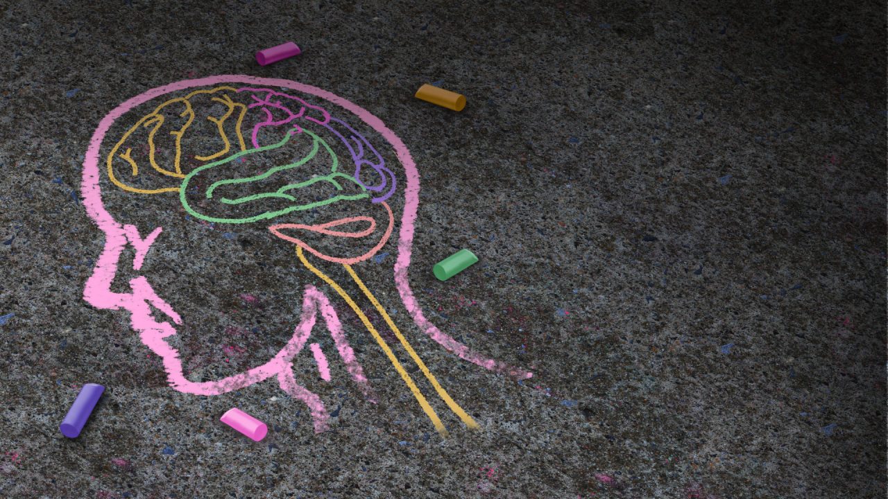 Concept of autism and autistic development disorder as a symbol of a communication and social behavior psychology as a chalk drawing on asphalt in a 3D illustration style.