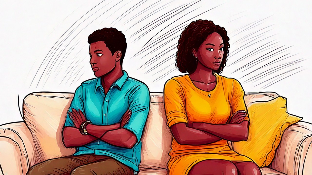 A male/ female couple sit on couch with arts crossed, facing away from each other, communicating hurt feelings.