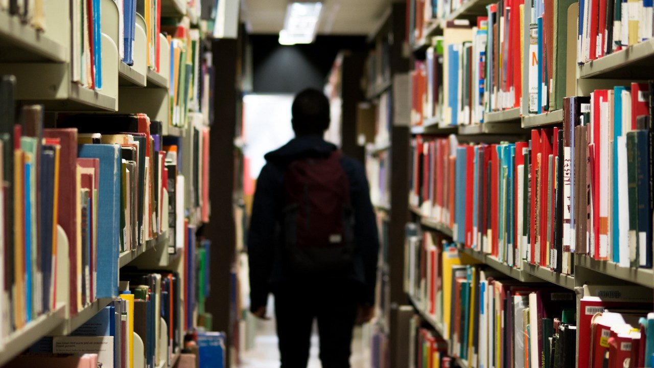 teen with ADHD is in the library to talk about ADHD accommodations and 504 plan to manage ADD symptoms at school
